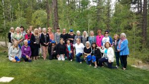 Gathering in Wendy's beautiful yard to celebrate the Installation of our new board for 2022-2023