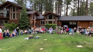 Gathering in Wendy's beautiful yard to celebrate the Installation of our new board for 2022-2023