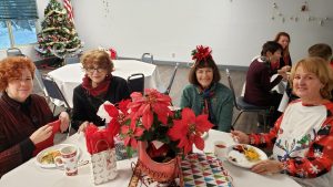 Holiday celebration including guests and the Mr. and Mrs. Wright game