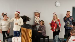 Holiday celebration including guests and the Mr. and Mrs. Wright game