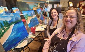 SITSters learning painting techniques at Paint and Sip