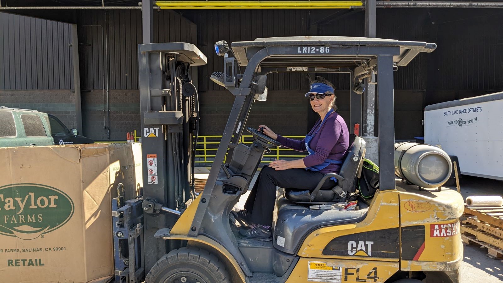 mandy SITsters helping out with the forklift at the E-waste drive