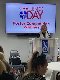 2 Emcee Colleen explaining the criteria for the Poster Competition